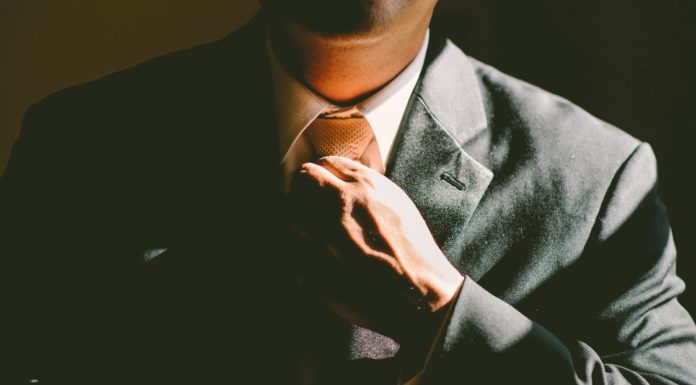 How I Bagged 3 Jobs Without Ever Showing My CV Man Adjusting Tie