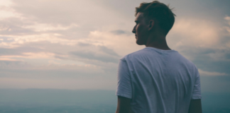 13 Ways To Be Mentally Stronger Today Man looking into the distance