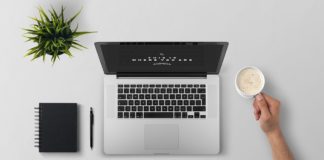 Ways To Stay Motivated While Doing An Online Course Desk with a laptop, notepad and coffee