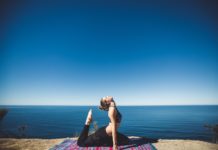 Meditation: A Guide to Mindfulness Woman doing yoga by the sea side