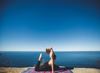 Meditation: A Guide to Mindfulness Woman doing yoga by the sea side