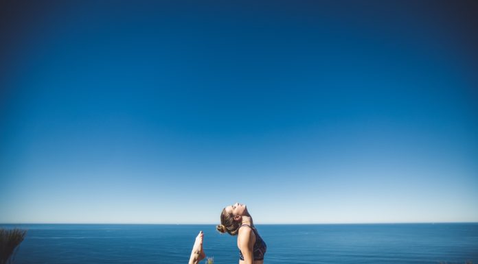 Meditation: A Guide to Mindfulness Woman doing yoga by the sea side