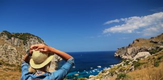 6 Ways To Make The Most Of Your Vacations Lady looking at the ocean, while her vacations