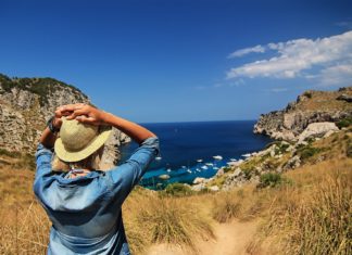 6 Ways To Make The Most Of Your Vacations Lady looking at the ocean, while her vacations