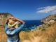 6 Ways To Make The Most Of Your Vacations Lady looking at the ocean, while her vacations