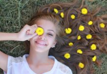 Here’s Why Happiness Absolutely Deserves You Happy girl lying on grass