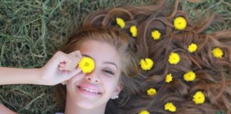 Here’s Why Happiness Absolutely Deserves You Happy girl lying on grass