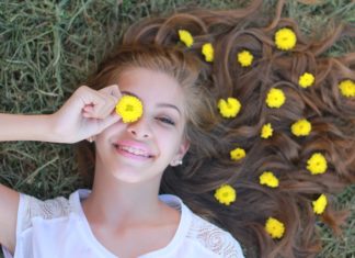 Here’s Why Happiness Absolutely Deserves You Happy girl lying on grass