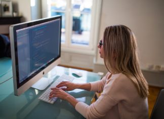 7 Things You Need To Know When You Start Your First Job Woman working on her first job