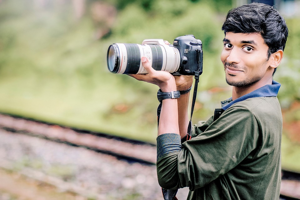 Boy posing with Camera - PixaHive